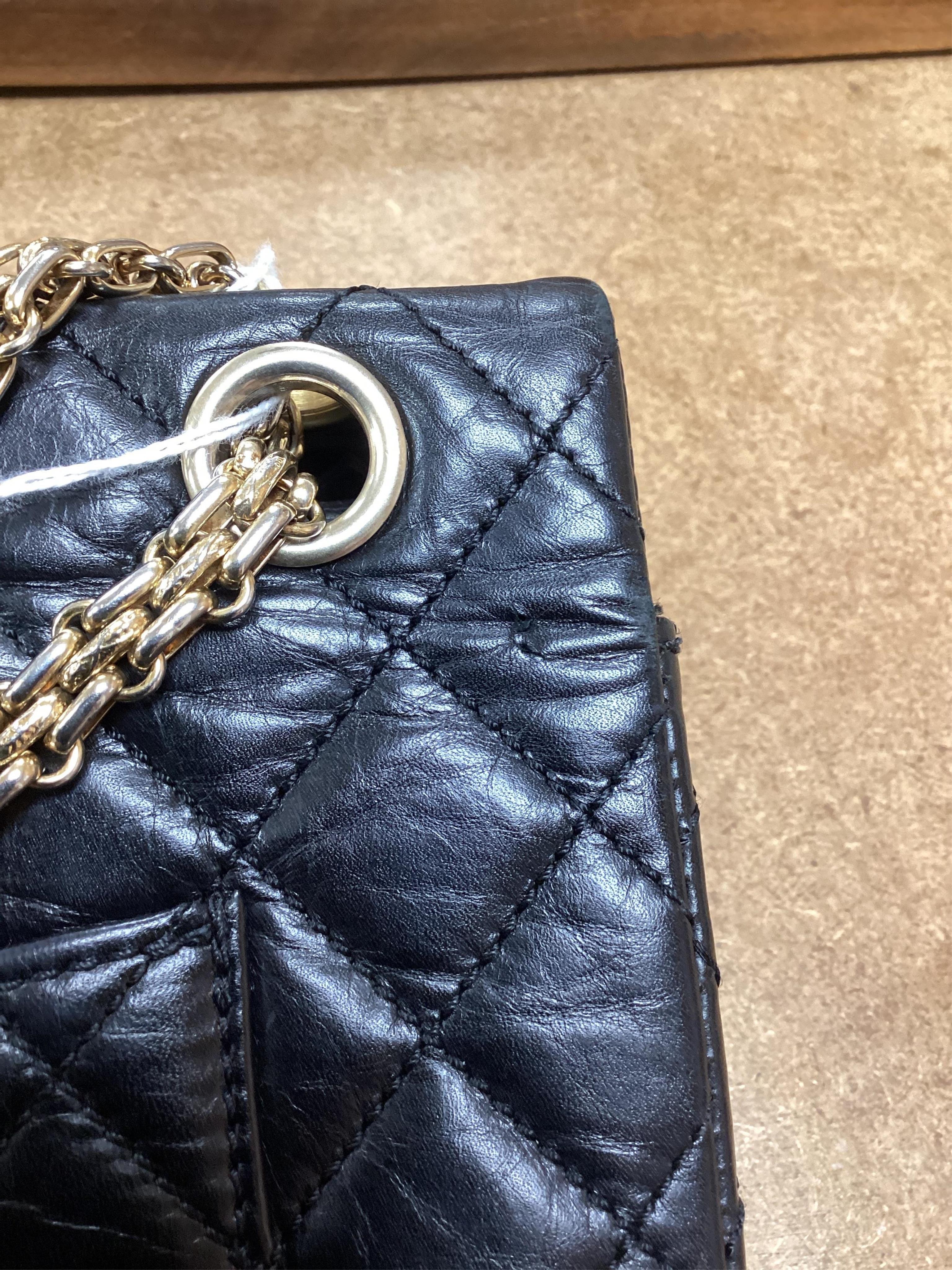 A Chanel 2.55 black leather handbag
